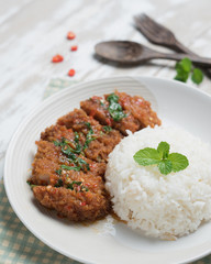 Thai spicy food,Stir-fried pork whit basil with rice on wood