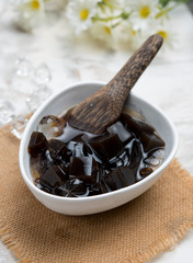 Grass jelly with ice in white bowl,Thai dessert.