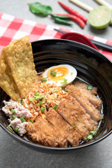 Thai spicy noodle,Thai noodle tom yum with fried pork and egg