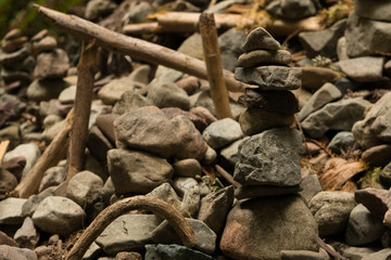 Stacked smooth river stones in a redwood forest in California