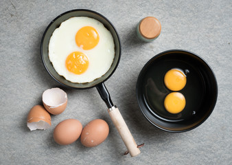 Fried eggs in a frying pan,top view