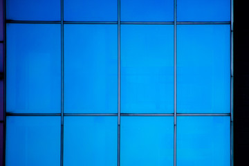 Texture of the blue glass windows of the building