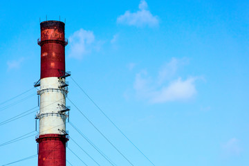 Industrial pipe against the background of a clear sky