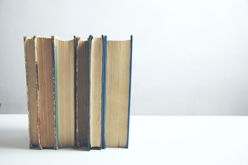 books on white table background