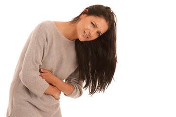 Young woman with stomach ache suffering isolated over white background