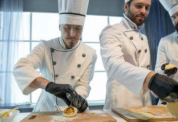 Cook cooks pies with cabbage