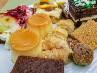 Delicious fresh colorful cakes on a dessert plate

