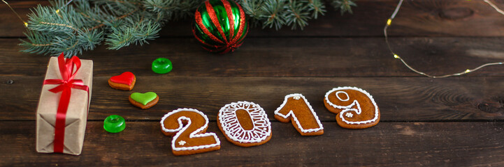 gingerbread and gifts happy new year. festive background. . food background. top view