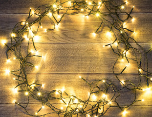 Christmas Light or Garland Lights on Wood Background