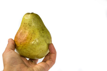 Pear in hand isolated on white background.