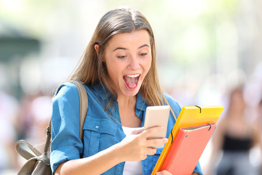 Excited student receiving good online news