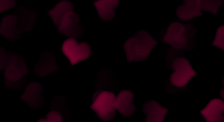 Bokeh red hearts on a black background.