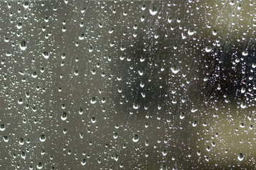 Naklejka na ściany i meble Water drops on window glass