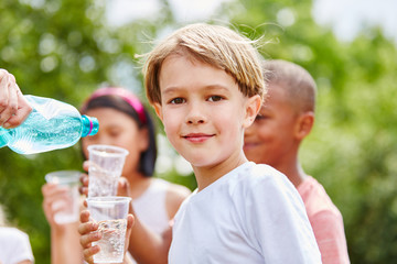 Boy drinks fresh water