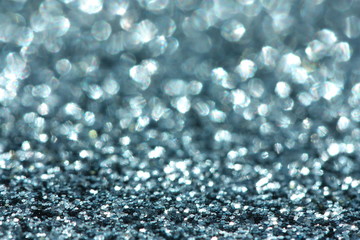 Blue glitter background. Christmas, New Year, party or festive background.