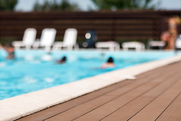 blurred background pool in a summer sunny day.