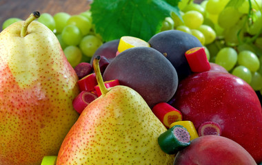 different fruits and sweets in the garden closeup