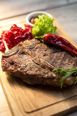 Appetizing steak on a wooden board