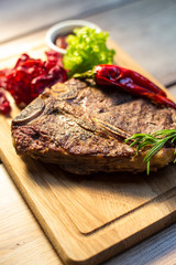 Appetizing steak on a wooden board