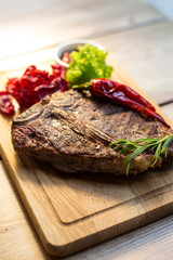 Appetizing steak on a wooden board