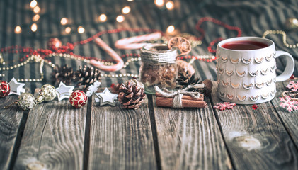 mulled wine in a cup on a wooden background