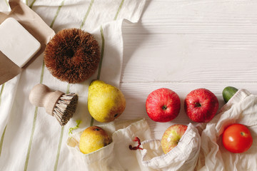 eco natural bags with fruits and coconut soap and brushes, eco friendly flat lay. sustainable...