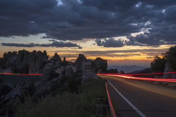 Long exposure image made on Mt. Lemmon, Arizona. The image shows vehicles driving through rock...