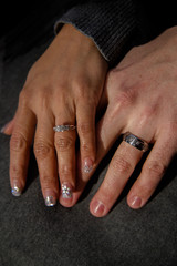 Married couple showing their wedding rings