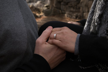 Engagement photos taken of a beautiful happy couple showing the engagement ring
