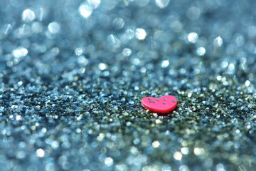 Glitter background with heart.