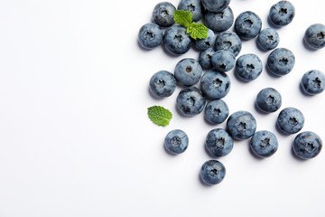 Flat lay composition with tasty blueberry and space for text on white background