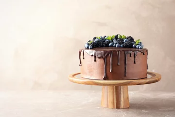 Zelfklevend Fotobehang Fresh delicious homemade chocolate cake with berries on table against color background. Space for text © New Africa