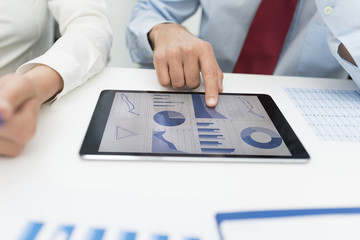 Business man using a tablet in his office during a meeting