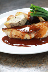 plated chicken with vegetables meal