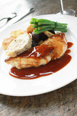 plated chicken with vegetables meal