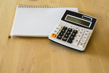 Calculator and pad to calculate business expenses
