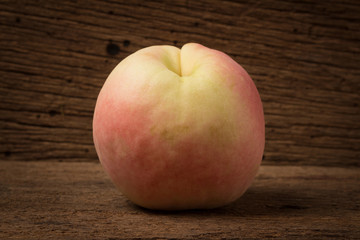 peach on old wood. sunlight