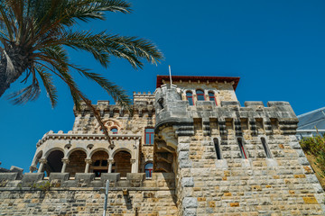 Obraz premium Estoril on Lisbon's Sunshine coast - Historical fortified Baronial mansion overlooking the beach