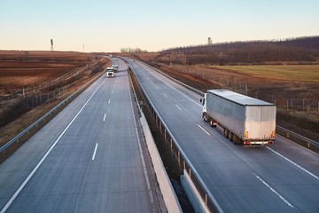 Highway with cargo trucks