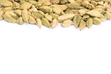 Pile of green Cardamom, cardamon isolated on white background (dried fruits of Elettaria cardamomum)