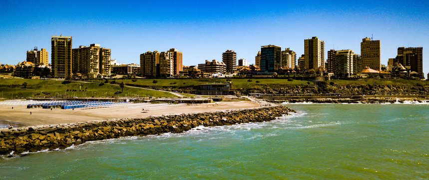 Sky view of Mar del Plata Argentina – high resolution drone photo of the Argentinian coast and downtown area of Mar del Plata Casino Central in spring time.  Buenos Aires Capital Federal district  