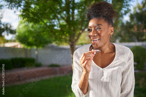 "happy african american woman smoking marijuana joint in ...
