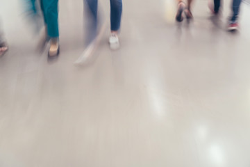 motion blur of people walking in the business office.