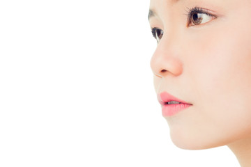 Fototapeta premium The face of a woman with good skin health and pink lips. Eyes are looking forward. copy space for use in advertising beauty products.