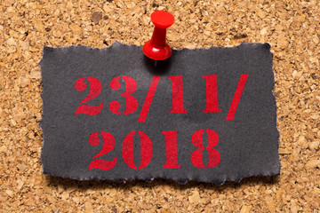 Mural message. Reminder of Black Friday. Red thumbtack. Text: 23/11/2018