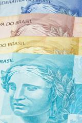 Closeup of varied values of Brazilian money. Economy of Brazil concept image.