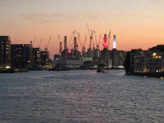 City skyline of London at dusk. River Thames, Enbassy Garden, Battersea Power Station. 