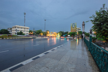 Fototapeta na wymiar Night view and rain shower in Mahakarn fort, Mahachai Road, Wat Boraveiwet, Pom Prap Sattru Phai, Bangkok, Thailand