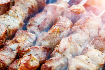 Barbecue skewers with meat on the brazier. Pork shish kebab