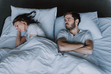 Young Attractive Couple Having Problem in Bed
